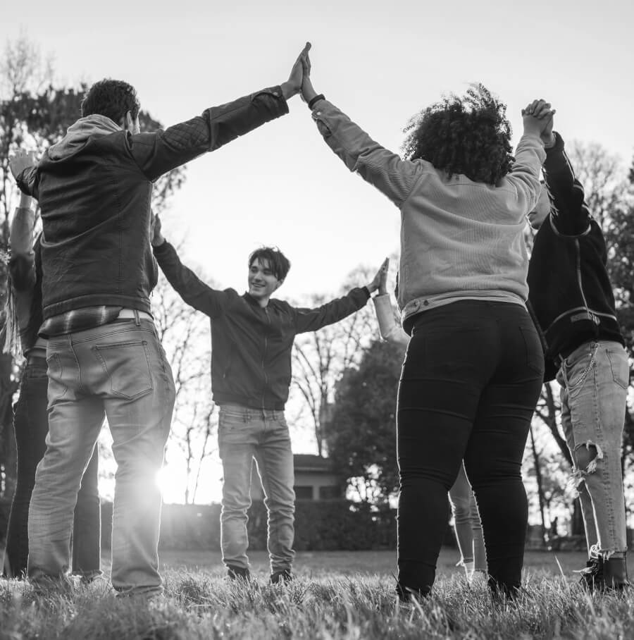 Values In Action Award Giveaway group of people doing high five in a circle